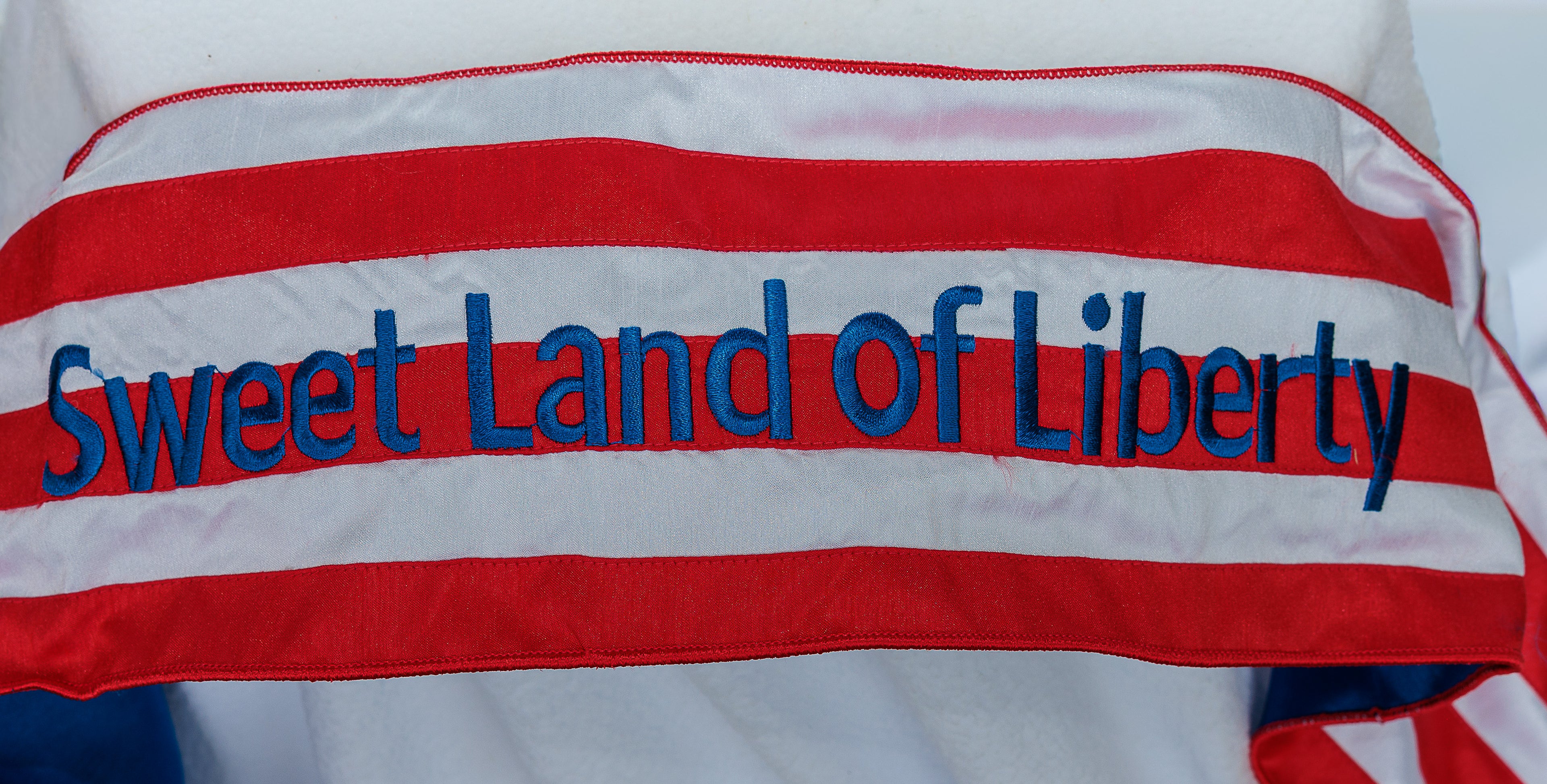 Dupioni silk, embroidered stars and bright white flag, sweet land of Liberty