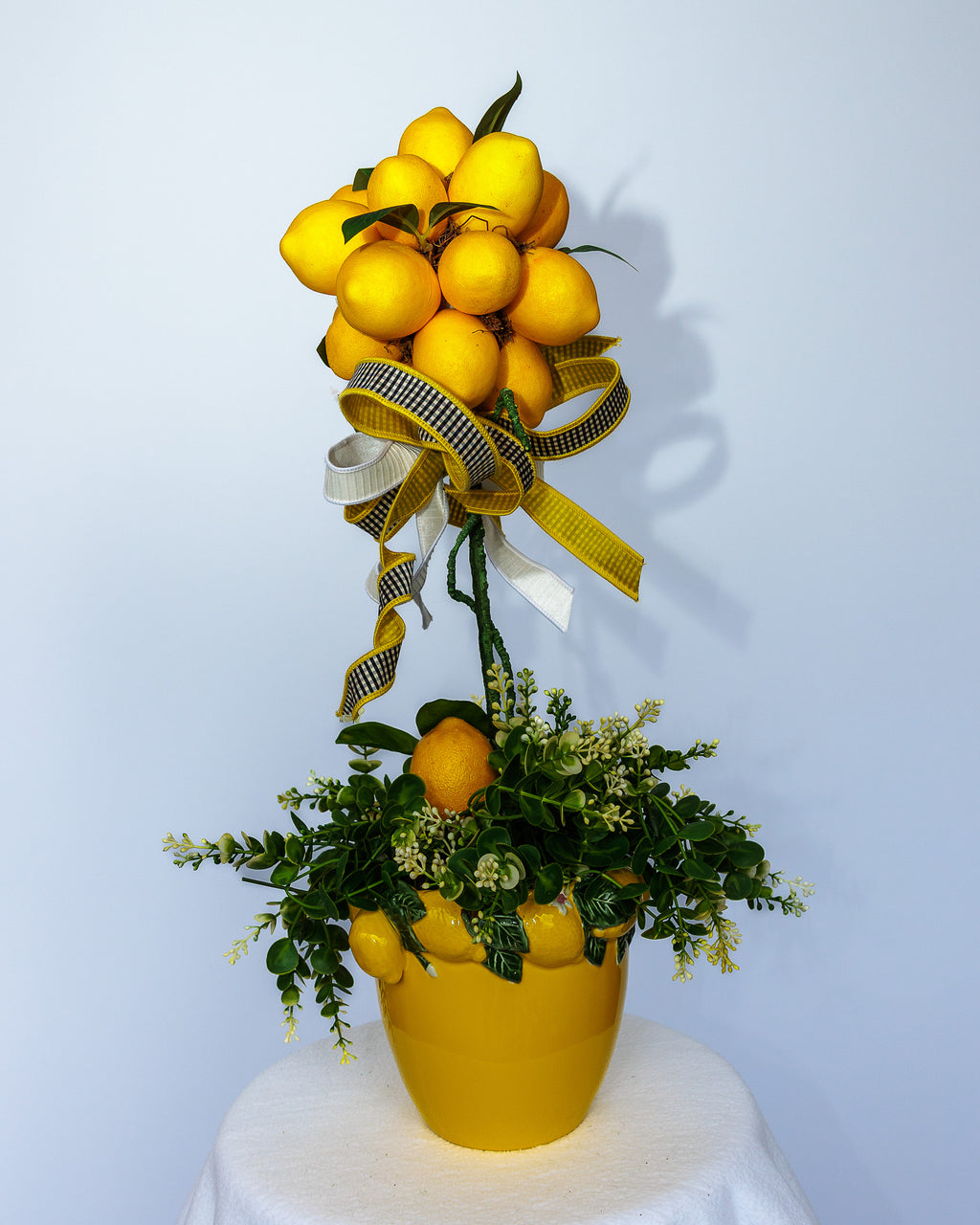 Yellow ceramic lemon vase with lemon topiary