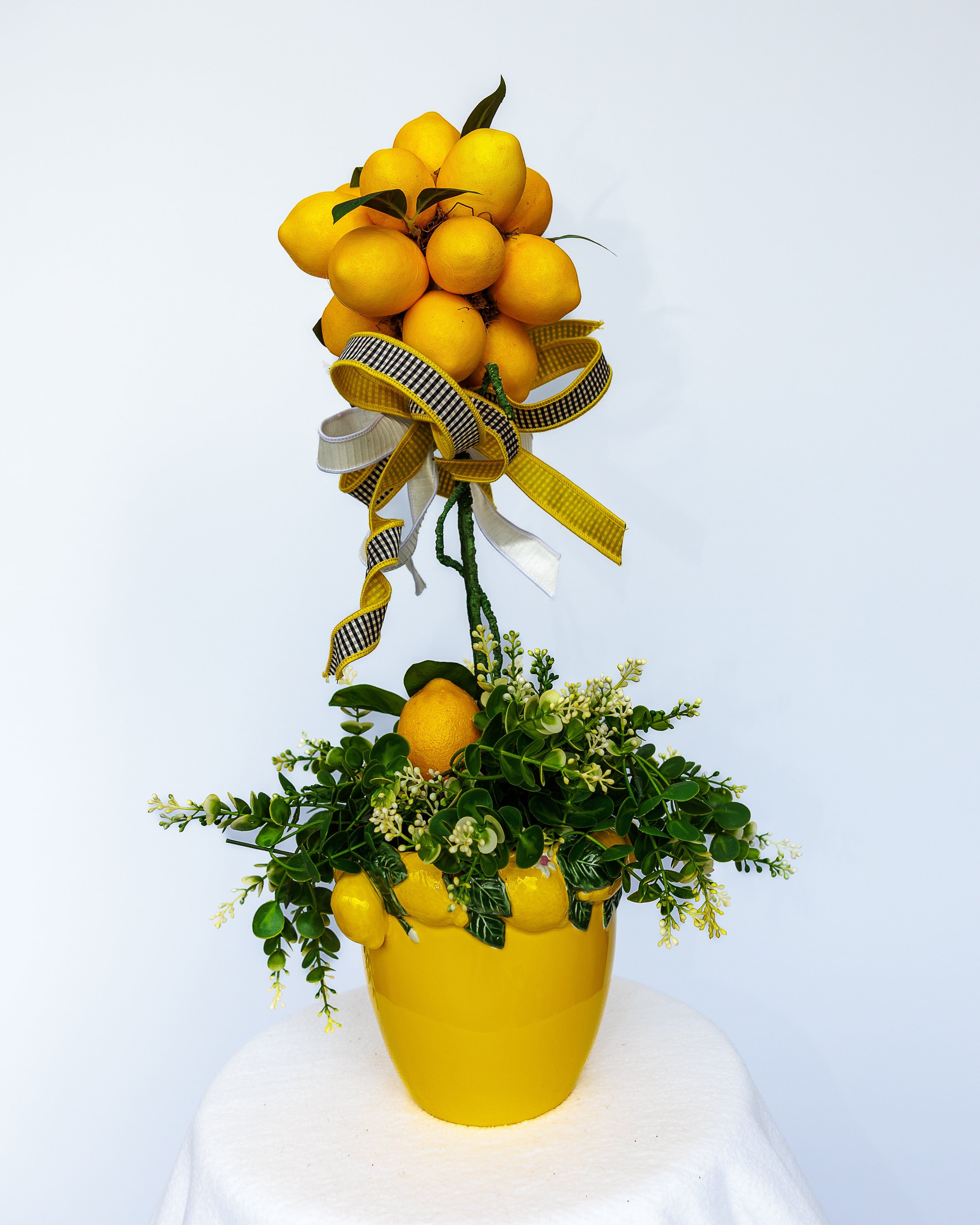 Yellow ceramic lemon vase with lemon topiary