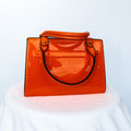 Orange Ceramic purse with leather handles